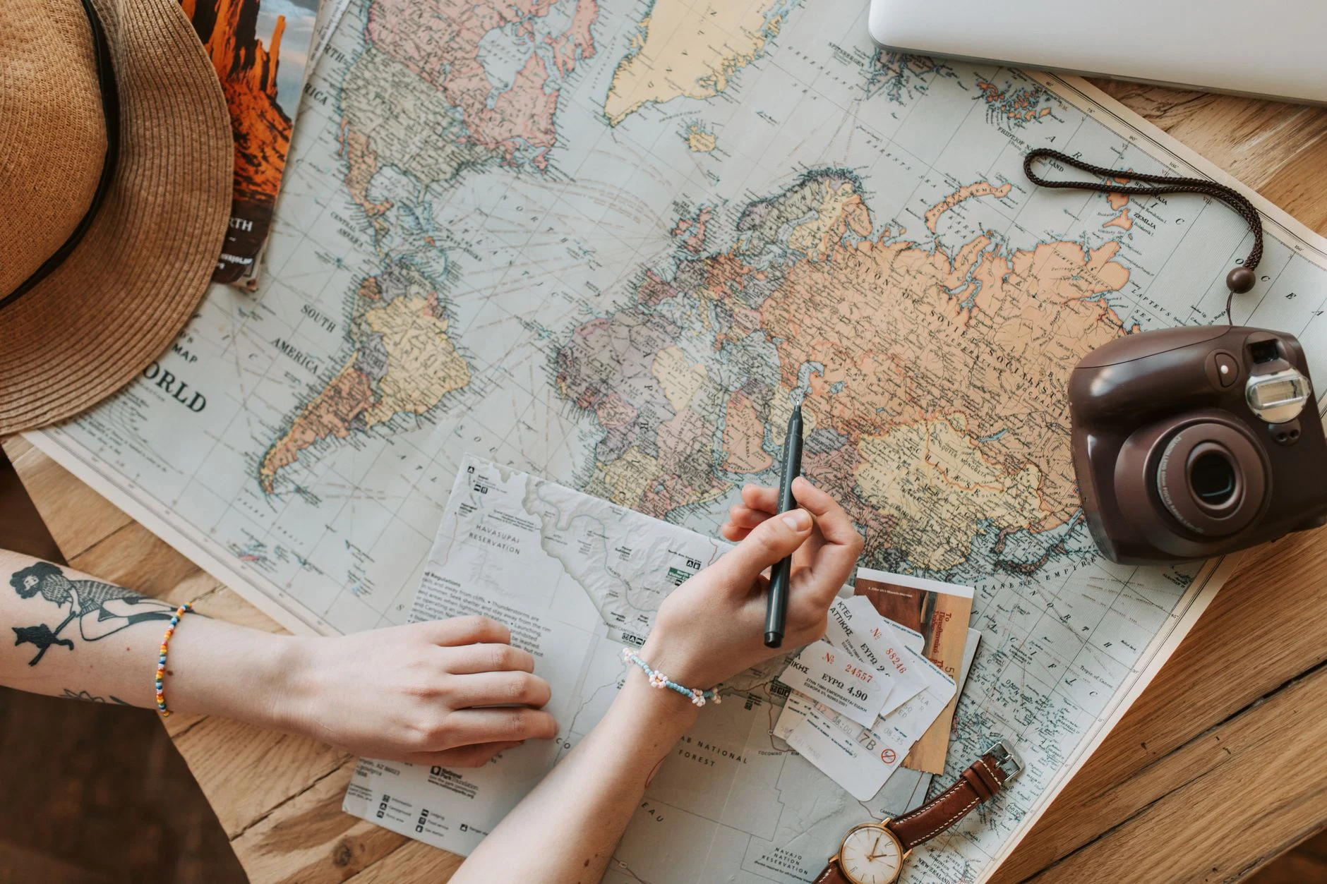 Notebook and travel-planning materials.